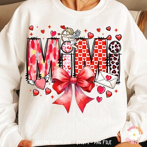 May include: White sweatshirt with a red, pink, and black graphic design that says "Mimi" with hearts and a cupid.