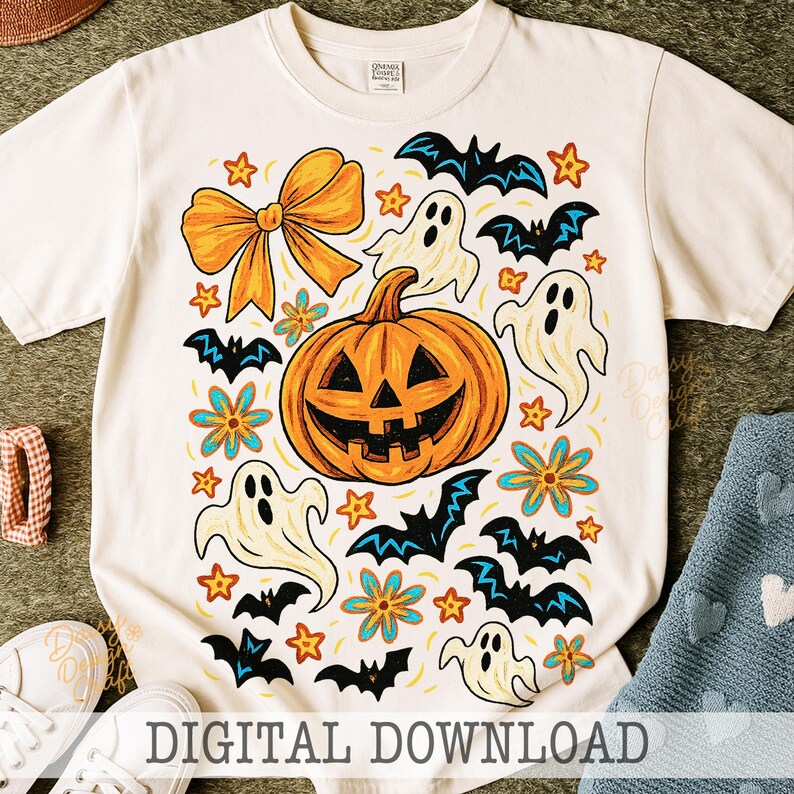 May include: White t-shirt with a Halloween-themed graphic. The design features a smiling orange jack-o'-lantern, ghosts, bats, stars, and flowers. A large orange bow is at the top. The words "DIGITAL DOWNLOAD" are at the bottom.