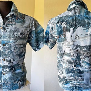 May include: A short-sleeved button-down shirt with a blue and white print of a Japanese landscape. The shirt has a collared neckline and a button-up front.
