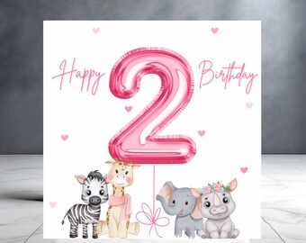 May include: A birthday card with the words "Happy Birthday" and a large pink number "2" balloon. Below are illustrations of a zebra, giraffe, elephant, and rhino. Pink hearts are scattered around the card.