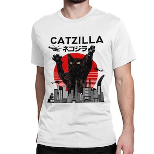 May include: White t-shirt with a black cat monster graphic, a red sun, and the text "CATZILLA ネコジラ".