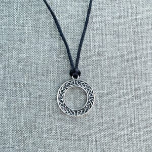 Round Celtic Knot pendant on a black nylon cord