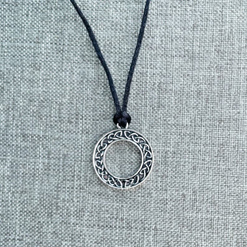 Round Celtic Knot pendant on a black nylon cord