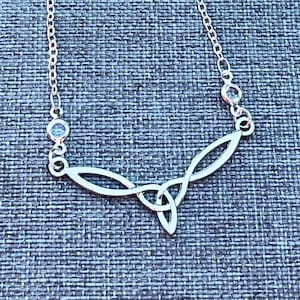 Celtic Trinity Knot Irish Necklace on Crystal Station Chain. Book of Kells pendant.