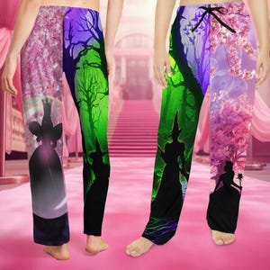 May include: Two pairs of pajama pants with a split design. One side features a pink cherry blossom scene with a silhouette of a princess. The other side has a green and purple forest scene with a witch silhouette.