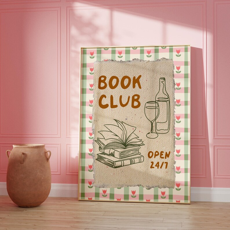 May include: A framed print with a gingham background in pink and green with a white floral pattern. The print features a brown paper texture with the text "BOOK CLUB" in brown lettering. There is a drawing of a stack of books, a wine glass, and a bottle of wine. The text "OPEN 24/7" is below the drawing.