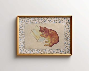 May include: A framed illustration of an orange cat reading a book. The cat is lying on a cream-colored background with a blue and green floral border.