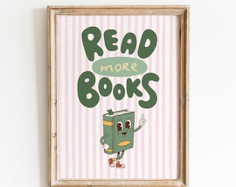 Puede incluir: Una impresión enmarcada con un fondo a rayas rosa y blanco. La impresión presenta un personaje de libro de dibujos animados verde con el texto "Read More Books" en verde.
