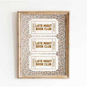 May include: Three white tickets with brown text that reads "Late Night Book Club" and the numbers "208514", "208515", and "208516". The tickets are displayed on a pink and blue floral background.