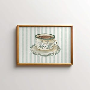 May include: A framed watercolor painting of a cup of coffee on a saucer with a green and white striped background.