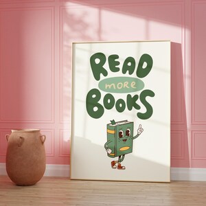 May include: A green and white poster with the text "READ MORE BOOKS" in a whimsical font. A cartoon book character with a green cover and red shoes is pointing upwards.