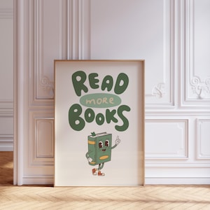 May include: A green and white poster with the text "READ MORE BOOKS" in a whimsical font. A cartoon book character with a smiling face and red shoes is standing next to the text.