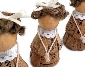 Small 2 1/2” cork girl figurine, cream bow