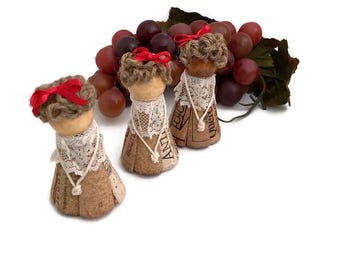 Small 2 1/2” cork girl figurine, red bow