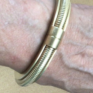 VINCE CAMUTO Gold tone Ribbed Clamper Bangle Bracelet (TB100)