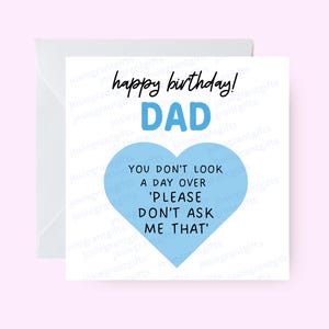 May include: A white birthday card with a matching envelope. The card features the text "happy birthday!" and "DAD" in blue. Below, a blue heart shape contains the text "YOU DON'T LOOK A DAY OVER 'PLEASE DON'T ASK ME THAT'".