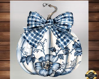 May include: A white pumpkin with blue floral and leaf designs, and a blue plaid bow. The pumpkin has a curved stem and is set against a light gray background. A gold-colored seal with the words "Best Quality Premium" is in the lower right corner.