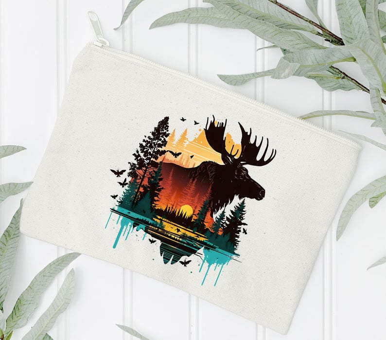 May include: A white canvas zippered pouch with a colorful graphic of a moose standing in a forest with a sunset in the background.