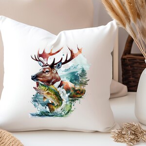 May include: White square cushion with a watercolour design of a deer with large antlers and a fish leaping from water. The deer is brown and orange, and the fish is green and yellow. The background includes mountains and trees.