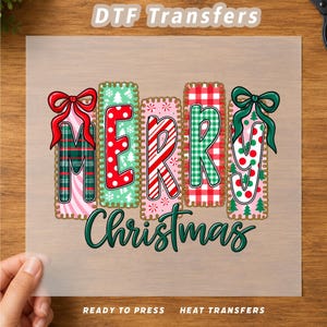 May include: A DTF transfer sheet featuring the text Merry Christmas. The word Merry is composed of five rectangular blocks with red, green, and white patterns including plaid, polka dots, and candy cane stripes, topped with red and green bows.