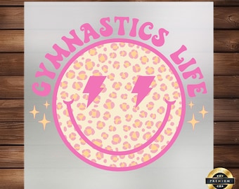 May include: Pink and yellow smiley face with a leopard print design and the text "Gymnastics Life" in pink letters.