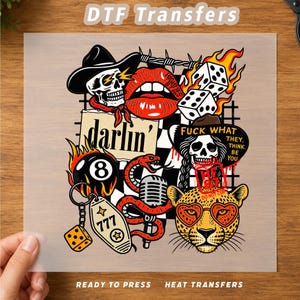 May include: A DTF transfer sheet featuring a collage of graphic illustrations including a skull in a cowboy hat, red lips, flaming dice, a black eight ball, a snake, a microphone, a leopard face with heart glasses, and a motel key tag with 777.