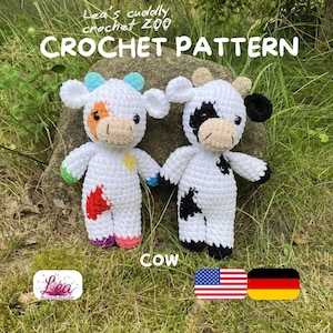 May include: Two crocheted cow plush toys featuring white bodies with colorful patches. The left cow has orange, yellow, green, and purple accents, while the right cow has black patches. Text reads: Lea's cuddly crochet ZOO CROCHET PATTERN COW.
