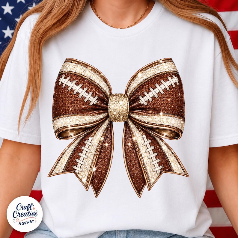 May include: A white t-shirt featuring a large graphic of a bow made from brown football-textured material with white laces and gold glitter accents. The center of the bow is a solid gold glitter knot, and the entire design has a sparkling finish.