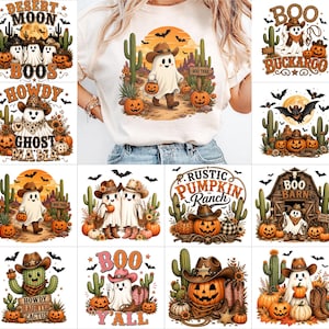 May include: A white t-shirt featuring a central graphic of a ghost wearing a cowboy hat and boots, walking on a desert trail with cacti, pumpkins, and a sunset background. The design includes the text BOO TRAIL and a warm color palette of orange, brown, and green.