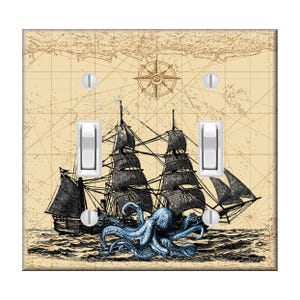 May include: A vintage style illustration of a ship being attacked by a blue octopus on a tan background with a compass rose in the upper center. The image is on a light switch plate.