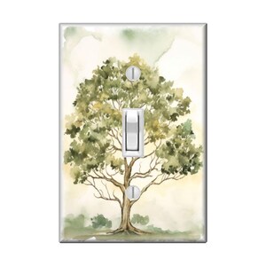 May include: A watercolor painting of a green tree with a light brown trunk on a light beige background. The image is designed to fit a light switch cover.