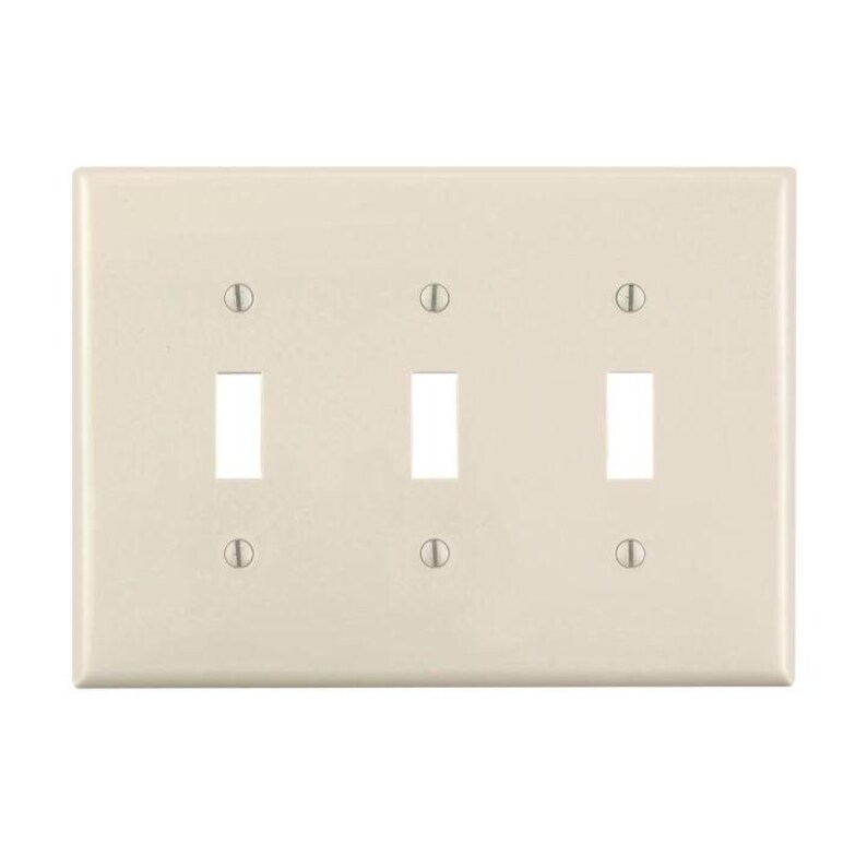 May include: A white plastic electrical wall plate with three toggle switch openings. The plate has a textured surface and is designed to cover electrical outlets and switches.
