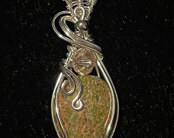 Wire wrapped unakite tear drop pendant with pink accent bead