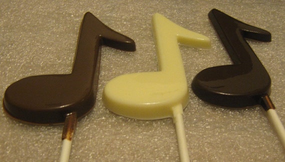 One dozen music note lollipop suckers