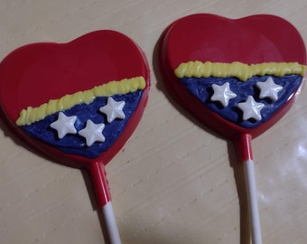 One dozen Wonder Woman inspired heart shaped lollipop sucker party favors