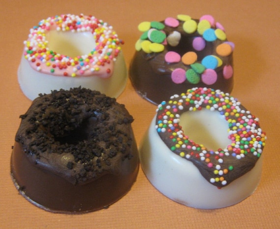 One dozen chocolate candy mini donuts with sprinkles