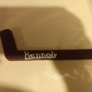 Solid chocolate hockey stick and hockey puck image 6