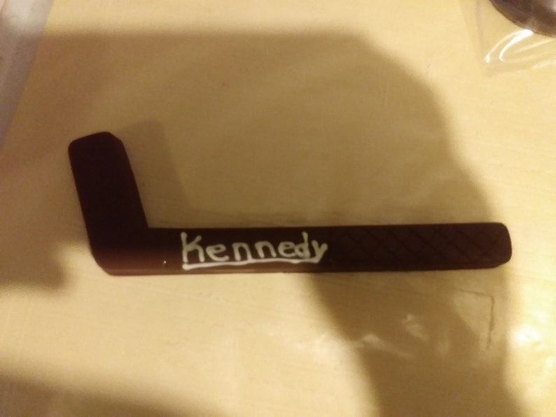 Solid chocolate hockey stick and hockey puck image 6