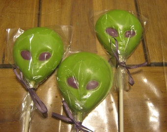 One dozen alien head chocolate lollipops