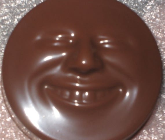 Smiling happy face chocolate covered sandwich cookie oreos party favors