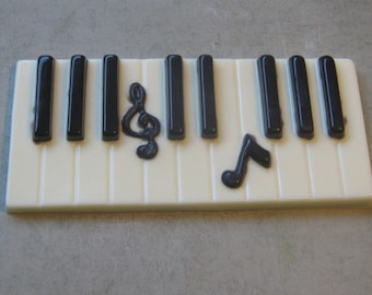 Solid chocolate piano keys keyboard with music note centerpiece cake topper