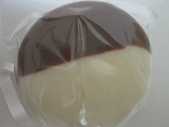 One dozen chocolate covered oreos with look of black and white cookies