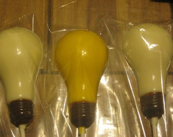 One dozen realistic light bulb lollipops