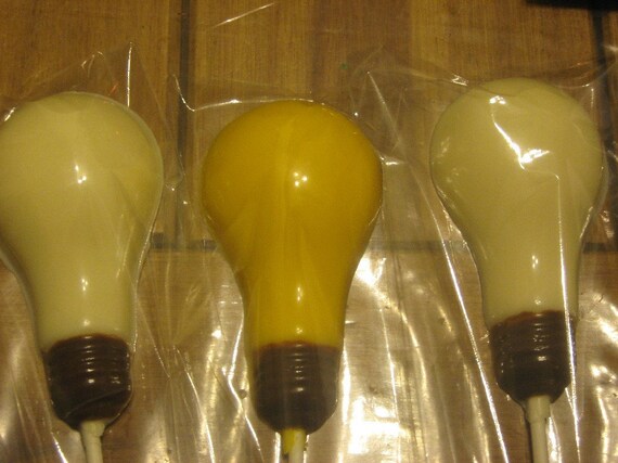 One dozen realistic light bulb lollipops