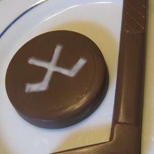 Solid chocolate hockey stick and hockey puck image 3