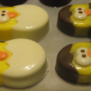 One dozen chick popping out of an egg chocolate covered sandwich cookie image 1