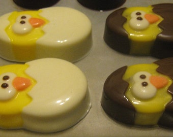 One dozen chick popping out of an egg chocolate covered sandwich cookie