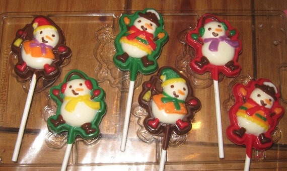 One dozen snowmen lollipop suckers