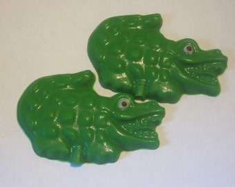 One dozen chocolate alligator candy pieces or lollipops