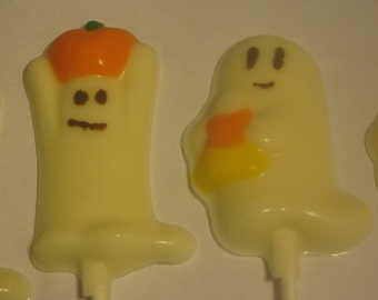 One dozen adorable ghost lollipop suckers party favors with pumpkins and candy corn